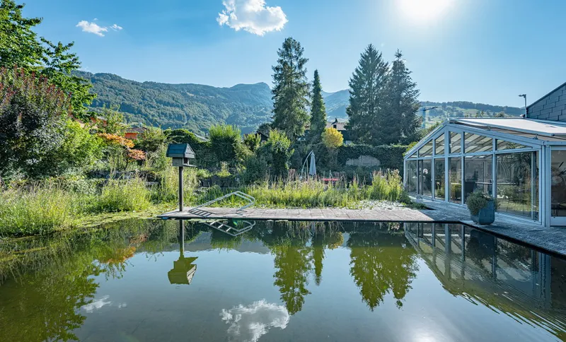 SINGLE-FAMILY HOME WITH AN EXCEPTIONAL GARDEN OASIS AND SWIMMING POND - Photo 3