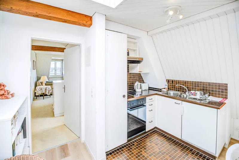A FIND UNDER THE ROOF — 1.5-ROOM ATTIC APARTMENT IN HORGEN - Photo 2